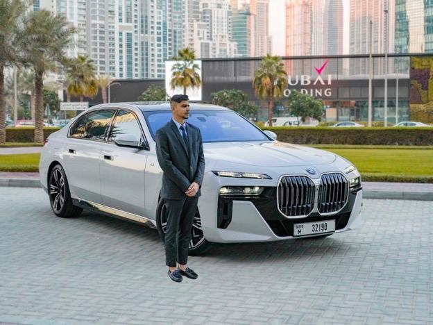 Luxury car with chauffeur in Dubai waiting for a client